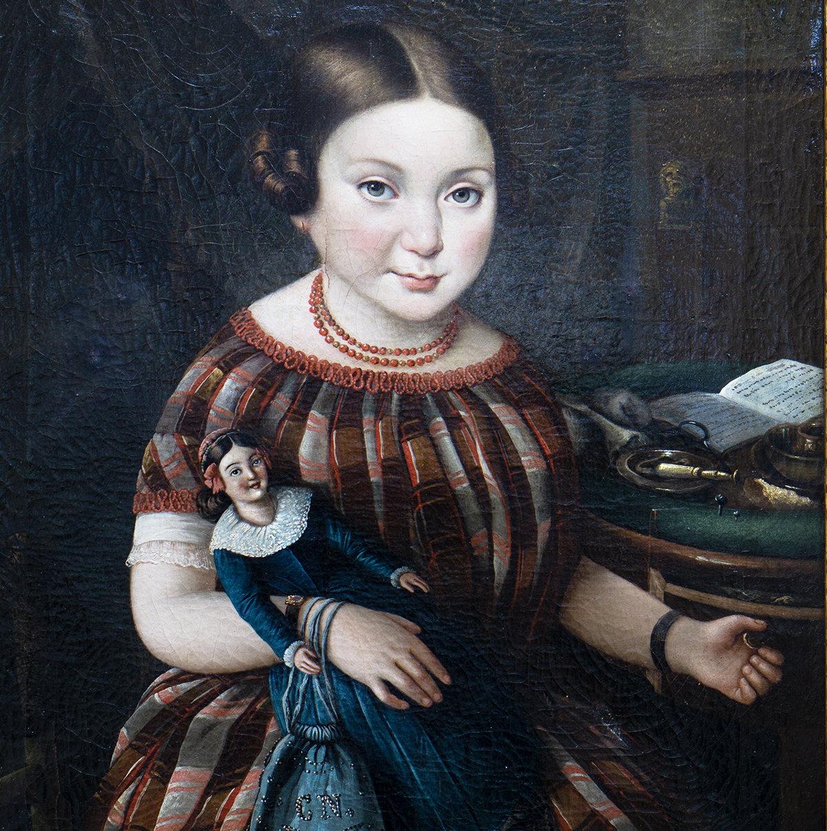 Portrait of a girl with doll 